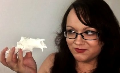 PhD student Kaylene Butler with a Balbaroo fangaroo model skull made by the UQ library 3D printing service.